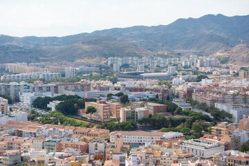 Obraz premium Aerial Cityscape with Mountain Backdrop