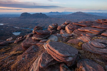 Pancake Shaped Rock on Cul Mor, Torridonian Sandstone in Assynt & Coigach, Scottish Highlands with Suilven & Canisp in the distance © Matt