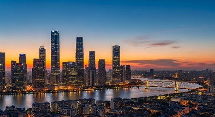 Fototapeta premium Cityscape skyline at sunset with buildings illuminated against a colorful sky