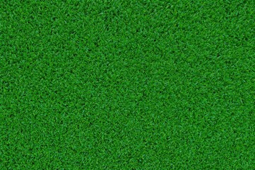 Synthetic green turf surface as a backdrop