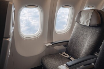 Obraz premium Aircraft Interior Featuring Seat and Window