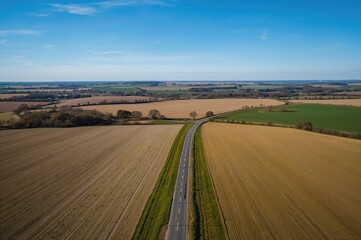 Bird's-Eye Perspective of a Highway Amidst Farmland in the Countryside
