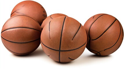 Group of basketballs arranged on a flat surface, showcasing their texture and design in detail during a practice session