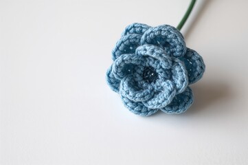 Blue crocheted floral design on a white backdrop, sample pattern