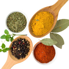 Culinary arrangement featuring an overhead shot of diverse spices and herbs, including vibrant yellow turmeric, fiery red chili powder, fragrant bay leaves, aromatic black peppercorns, and fragrant...