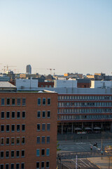 Fototapeta premium Urban cityscape with construction cranes and modern buildings