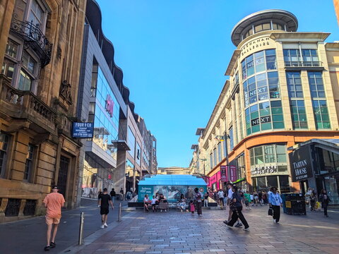 Lively crowd of shoppers on Buchanan Street, a popular pedestrian retail area in Glasgow