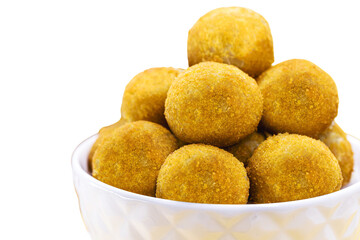 typical Brazilian fritter, savory fried in oil, with cheese, cassava, corn, cornmeal or aipin flavors, crispy and round dumpling served hot, white isolated background