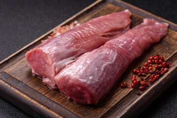 Raw pork tenderloin, fresh meat, a source of protein, and an ingredient for a meal. Pork tenderloin