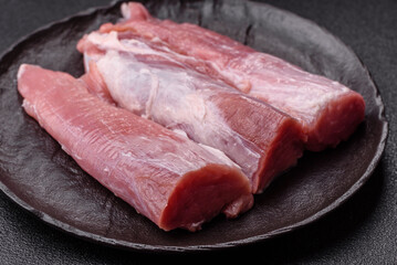 Raw pork tenderloin, fresh meat, a source of protein, and an ingredient for a meal. Pork tenderloin