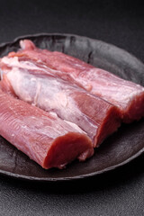 Raw pork tenderloin, fresh meat, a source of protein, and an ingredient for a meal. Pork tenderloin