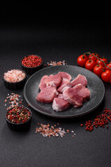 Raw pork tenderloin, sliced, is fresh meat, a source of protein. Pork tenderloin