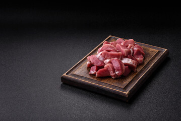 Raw pork, sliced, fresh meat, a source of protein, and an ingredient for a hearty meal. Raw pork