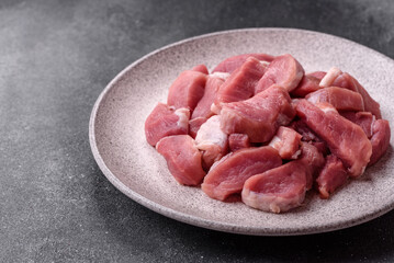 Raw pork, sliced, fresh meat, a source of protein, and an ingredient for a hearty meal. Raw pork