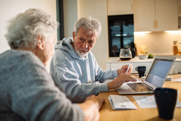 Elderly couple working on finances