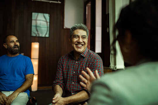 People talking in a group therapy session