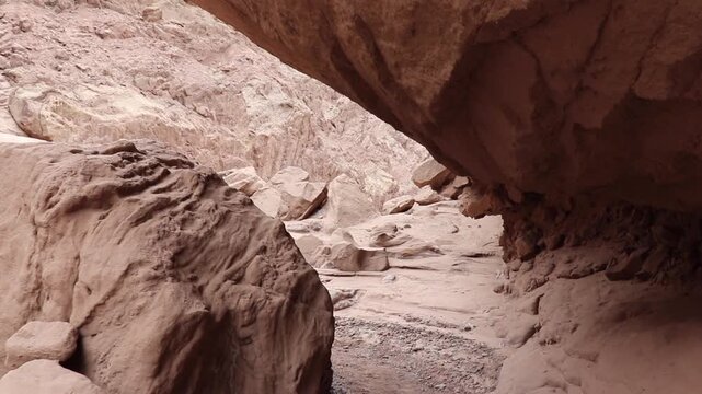 First person view of a person walking through the rock formations and trails of the Ca&ntilde;adon del Indio, Fiambala, Catamarca.