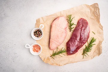 Fototapete Zu Essen Preparation for cooking raw duck breast with ingredients on white background, top view. Space for text. High quality photo  © petrrgoskov