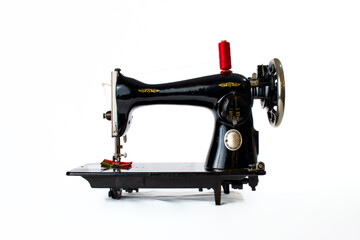 Fototapeta premium black vintage sewing machine on white background