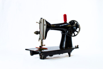 black vintage sewing machine on white background