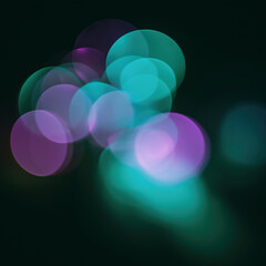 Colorful bokeh lights abstract background with soft neon circles and dreamy glow