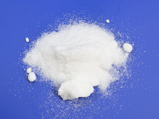 Metronidazole powder on blue background