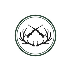 Emblem featuring crossed rifles, antlers, and a circular border, representing hunting.