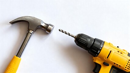 Hammer and electric drill on white background