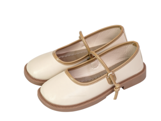 Cream shoes with brown trim and strap featuring classic round toe and sturdy sole isolated on transparent background. Ideal for children’s fashion, footwear, and elegant style themes.