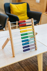 Close-up of colorful children's abacus in the kids' area, promoting learning and development.