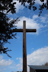 wooden cross on a blue sky background