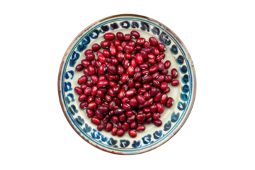 Vibrant red kidney beans elegantly arranged on a decorative plate, showcasing their rich color and texture in natural light isolated on transparent background