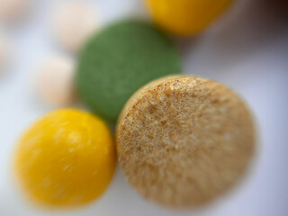 Macro photo of colorful medical pills and vitamins. Close up of pharmaceutical tablets in different shapes and colors on white background. Concept of healthcare, medicine, supplements and pharmacy.