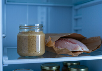 Baby food mashed fish in fridge