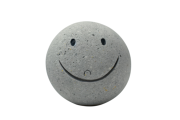 A cheerful stone with a smiley face, bringing joy and simplicity to any space or moment of contemplation isolated on transparent background