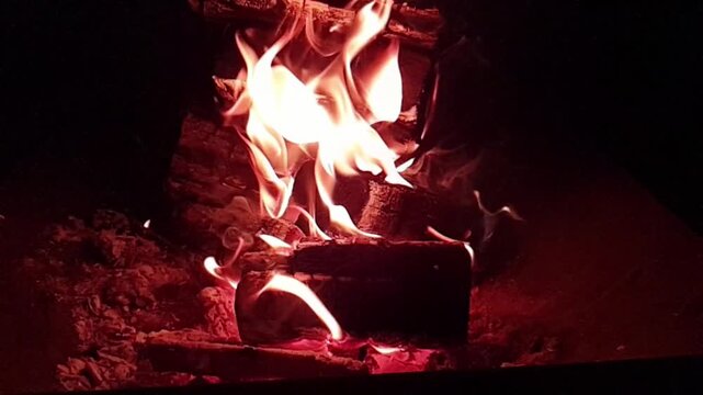fire burning at night in fire pit super slow motion video