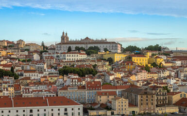 Fototapeta premium Panoramic Exposure done from a Cruise ship in the Cruise Ship terminal in Lisbon, of the Alfama neighborhood upon departure on the tagus river, Portugal