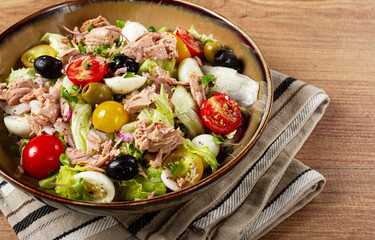 salad with canned tuna, vegetable salad with quail eggs, lettuce, red onion , cherry tomatoes , olives, keto food, healthy food, homemade, no people