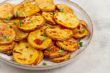 Crispy potato slices, with parmesan cheese and spices, fried in the oven, homemade, no people,