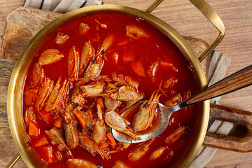 French shrimp bisque soup, in a pot, close-up, no people,