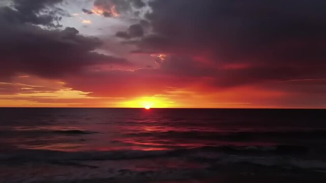 Dramatic sunset over ocean horizon fiery sky and water natural scenery scenic environment
