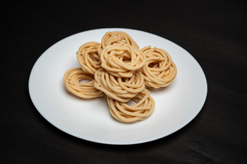Murukku is a savoury snack popular in south India and Sri Lanka. chakli south indian traditional vegetarian snack