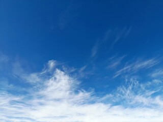 Fototapeta premium Cirrus clouds form at the highest levels of the sky, usually above 5,000 metres, and are thin, white clouds with a feather or thread-like appearance.
