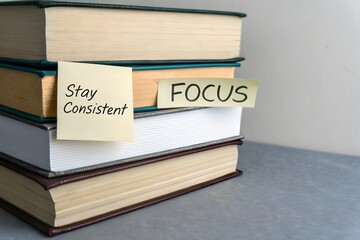Stack of hardcover books with Focus written on the spine