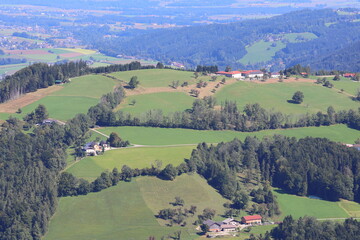 Idyllic panorama of a hilly agricultural landscape, farmland scenery, rural countryside, scenic view