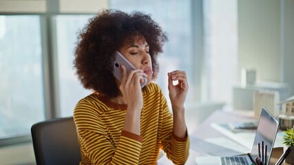 Executive explaining problem phone conversation in office with colleague closeup