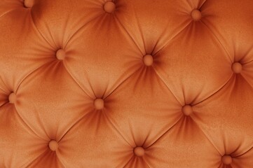 Detailed close-up of plush orange velvet material showcasing its soft texture, perfect for high-end interior decor and fabric-themed visuals.