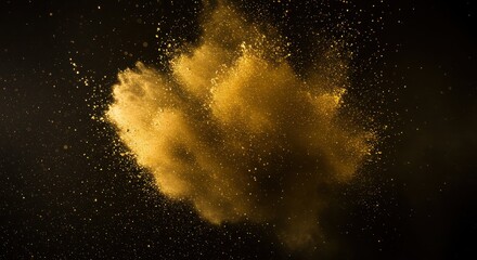 Obraz premium Golden powder explosion in dark background