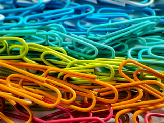 colorful paper clips on a white background