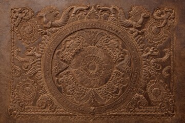 Traditional method of carving wayang figures on bovine leather